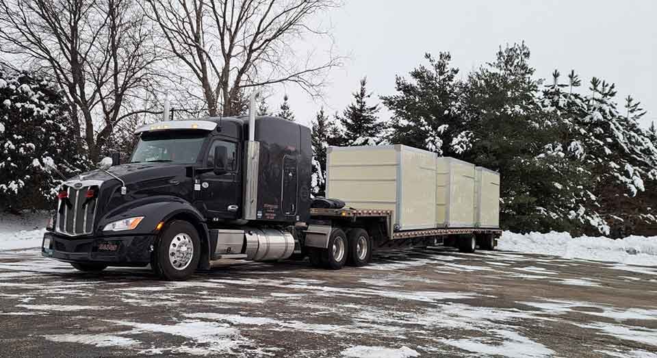 48-foot step deck (drop deck) trailer hauling tall industrial equipment — Bonafide step deck dispatch service