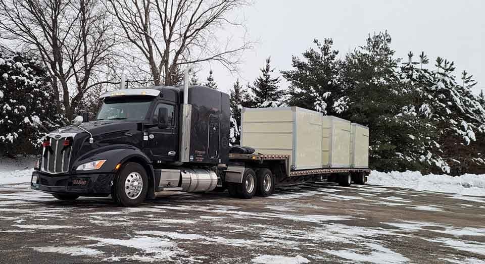 48-foot step deck (drop deck) trailer hauling tall industrial equipment — Bonafide step deck dispatch service